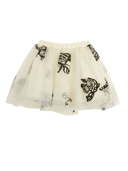 Cream Tulle skirt with Black applique. above knees, elasticated waist, for girls sizes 4-8 years old. brand fits large.