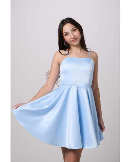 tween girl  wearing a light blue satin spaghetti strap fit and flare party dress 
